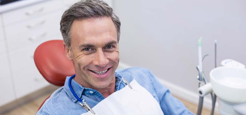 man in dental chair for oral cancer screen